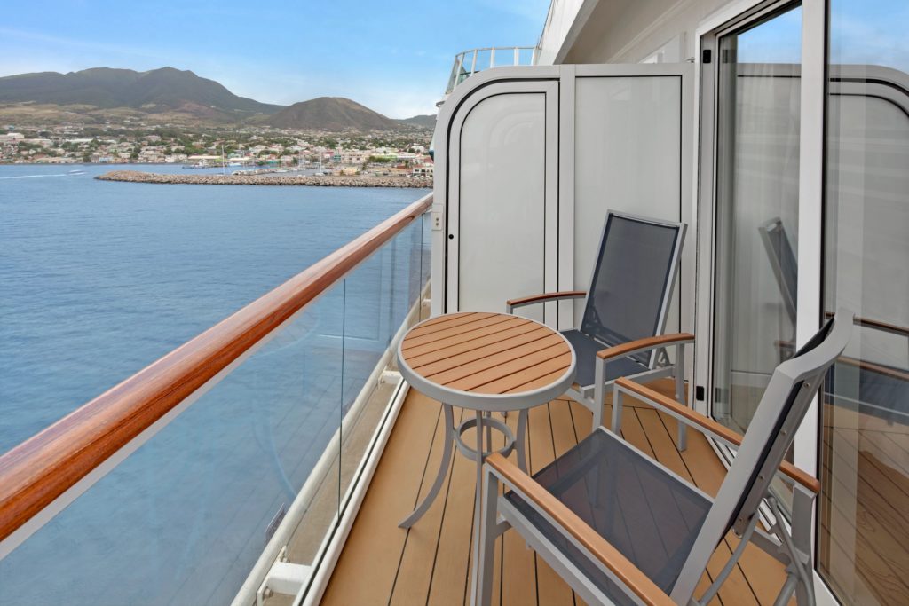 A cruise ship balcony with a breathtaking view of the ocean. by Chasing the Sun Vacations