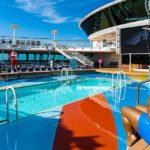 An All Inclusive swimming pool on a cruise ship offered by a Travel Agency. by Chasing the Sun Vacations