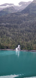 A view of a body of water with a mountain in the background. by Chasing the Sun Vacations